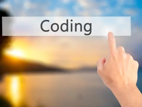 Coding - Hand pressing a button on blurred background concept on visual scree Stockfoto's