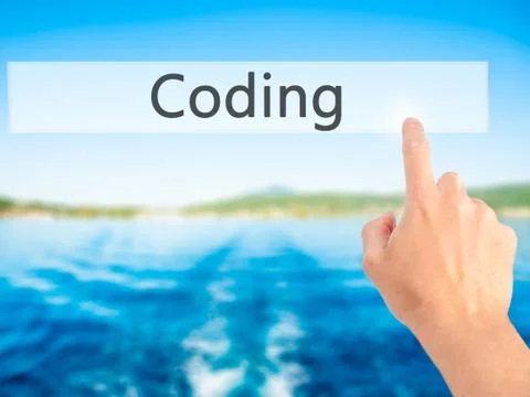 Coding - Hand pressing a button on blurred background concept on visual scree Stockfoto's