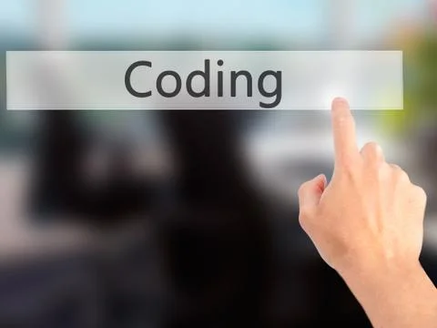 Coding - Hand pressing a button on blurred background concept on visual scree Stockfoto's