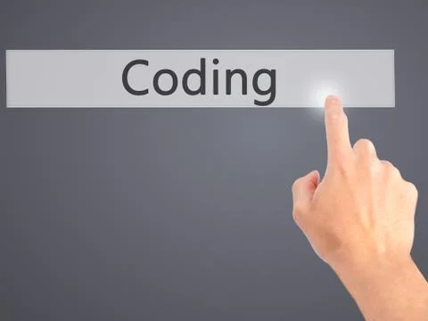 Coding - Hand pressing a button on blurred background concept on visual scree Stock Photos