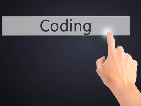 Coding - Hand pressing a button on blurred background concept on visual scree Stockfoto's
