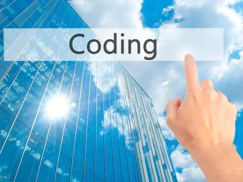 Coding - Hand pressing a button on blurred background concept on visual scree Stockfoto's
