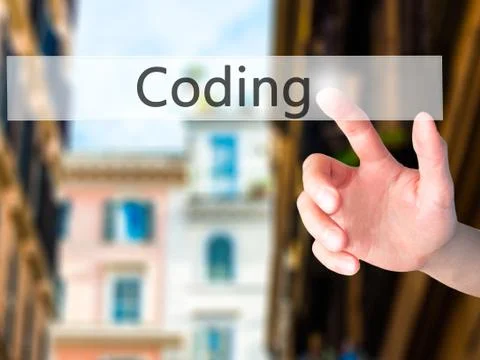 Coding - Hand pressing a button on blurred background concept on visual scree Stockfoto's