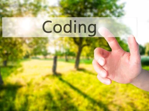 Coding - Hand pressing a button on blurred background concept on visual scree Stockfoto's