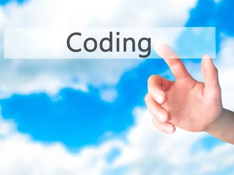 Coding - Hand pressing a button on blurred background concept on visual scree Stockfoto's