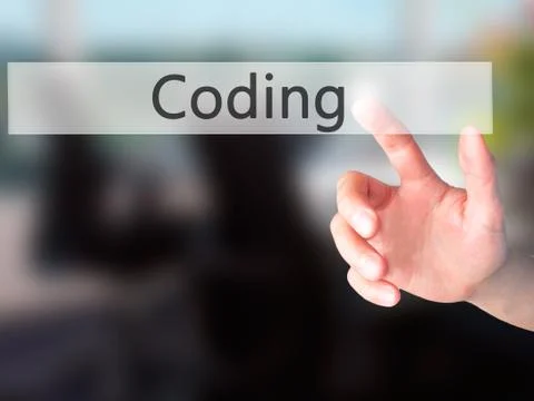 Coding - Hand pressing a button on blurred background concept on visual scree Stockfoto's