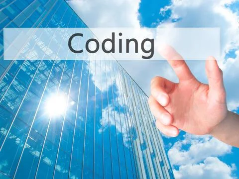 Coding - Hand pressing a button on blurred background concept on visual scree Stockfoto's