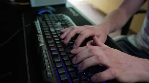 CODING - Hands of a man typing fast on keyboard while programming, close up Stock Footage 155608909