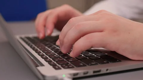 Coding hands work. Person in white sleeve entering commands on silver device Stock-Footage 347880147