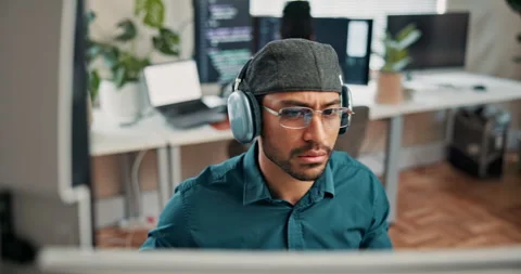 Coding, headphones or man in office with computer, radio streaming or debug Stock Footage 346940132