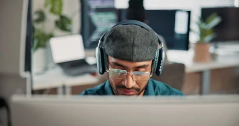 Coding, headphones or man in office with computer, radio streaming or debug Stock Footage 346948329