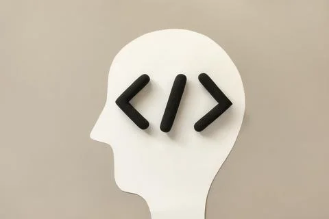 Coding language development icon inside a humans head. Software development Stock Photos
