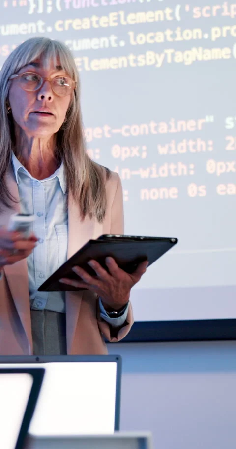Coding, lesson and teacher class slides at academy with mature woman, speaker Stock Footage 286405049