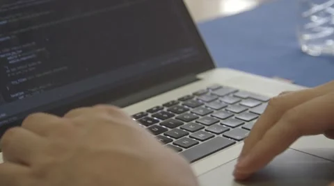Coding on a Macbook Pro computer Stock Footage 64565488