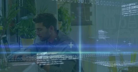 Coding male software developer wearing casual shirt focusing on laptop in office Stock Photos