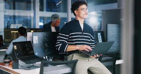 Coding, man and thinking with laptop in office for debugging solution, software Stock Photos