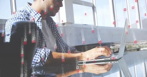 Coding man plaid shirt sleeves rolled typing on laptop by windows with binary 스톡 사진
