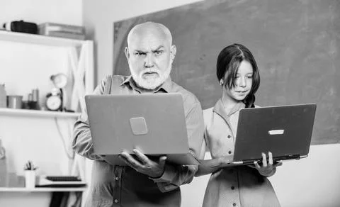 Coding is my spirit. new technology in learning. small girl with man tutor study Stock Photos