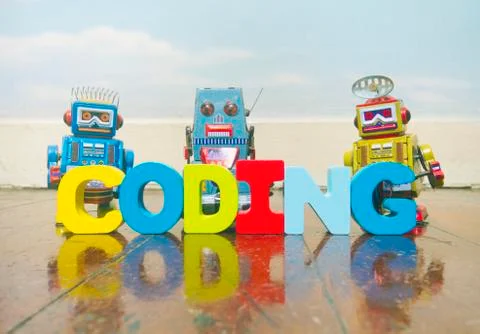 Coding robots on wooden floor Stock Photos