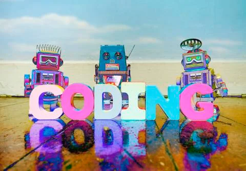 Coding robots on wooden floor Foto stock