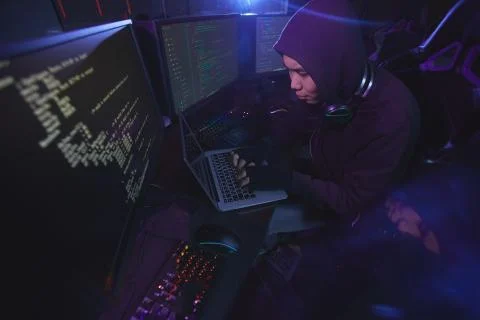 Coding Screens in Dark Foto stock