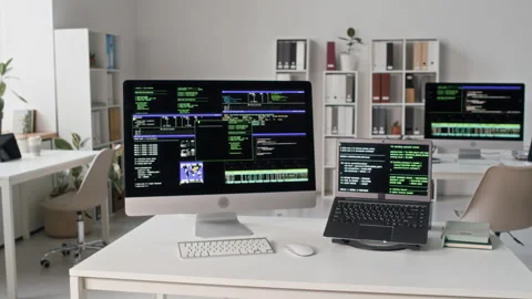 Coding Setup with Computer and Laptop Displaying Code In IT Office Stock Footage 330124103