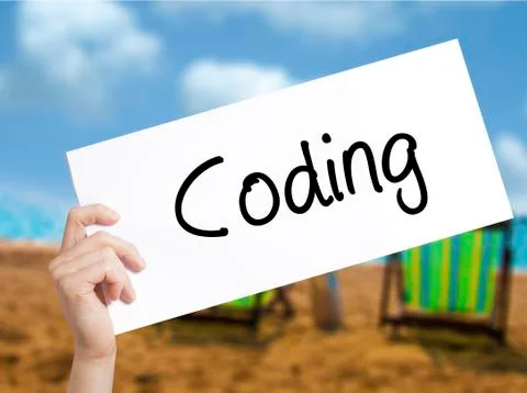 Coding Sign on white paper. Man Hand Holding Paper with text. Isolated on hol Stock-Fotos