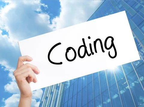 Coding Sign on white paper. Man Hand Holding Paper with text. Isolated on Sky 스톡 사진