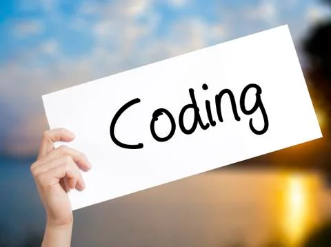 Coding Sign on white paper. Man Hand Holding Paper with text. Isolated on sun Stock-Fotos