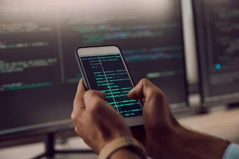 Coding, smartphone in hands and man, programmer and computer software update Foto stock