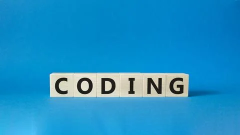 Coding symbol. Concept word Coding on wooden cubes. Beautiful blue backgrou.. Stock-Fotos
