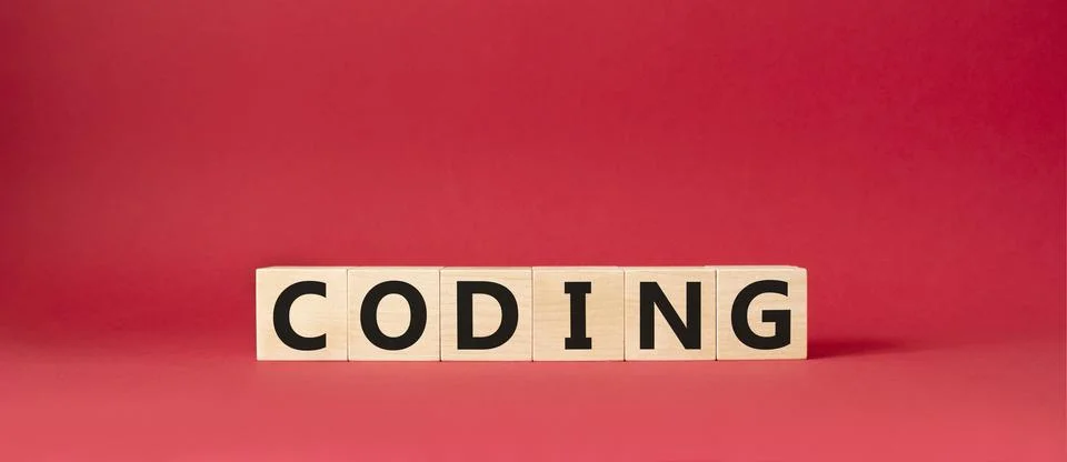 Coding symbol. Concept word Coding on wooden cubes. Beautiful red backgroun.. Stock-Fotos