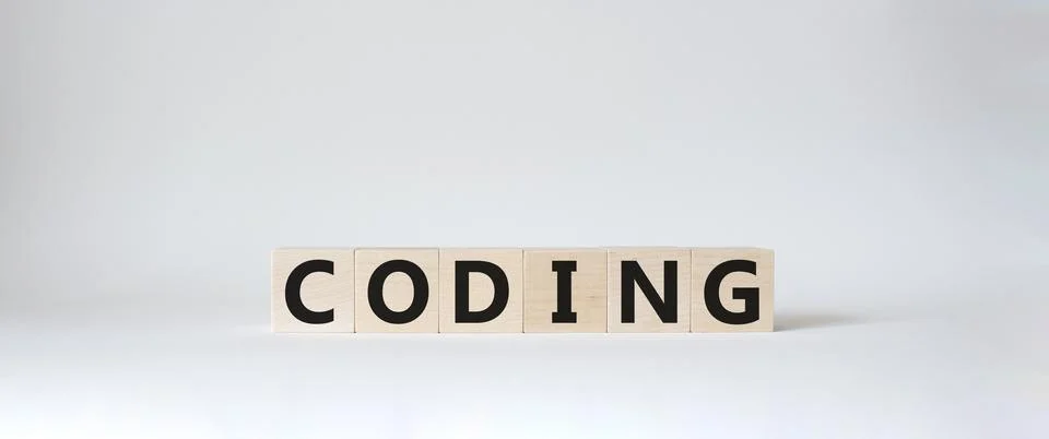 Coding symbol. Concept word Coding on wooden cubes. Beautiful white backgro.. Foto stock