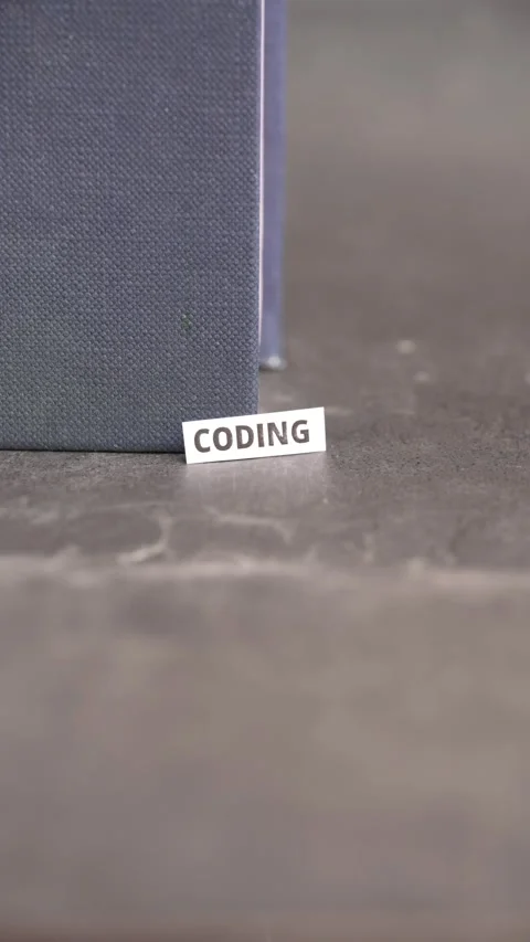 Coding Word on Paper Label Representing Software Development and Programming Stock Footage 338344592