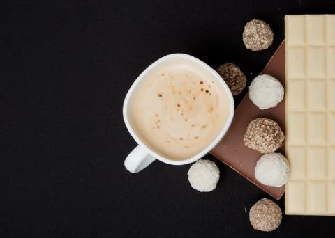 Cofe, Stack of Black and White Chocolate isolated on black background, place  Foto stock