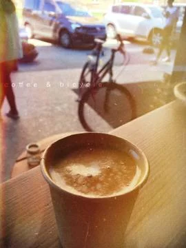 Coffe and bicycle Stock Photos