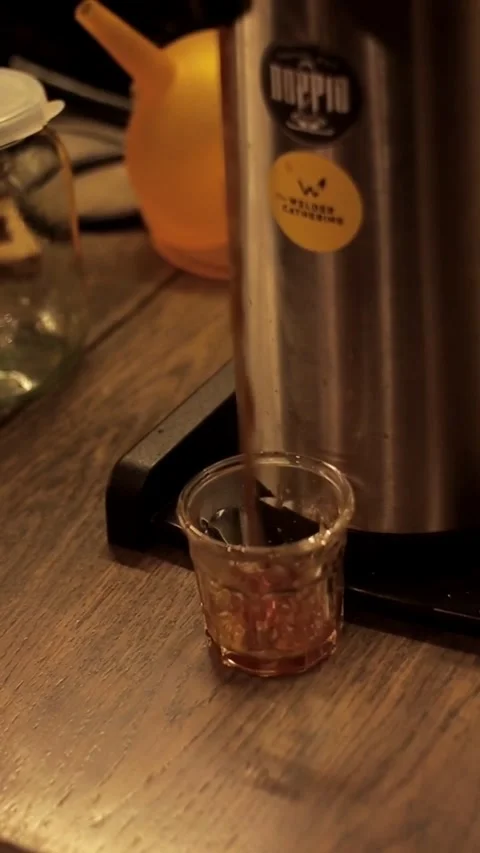 Coffe barista working to make a coffe. Hand drip coffeeTourists with drip coffee Stock Footage 161615827