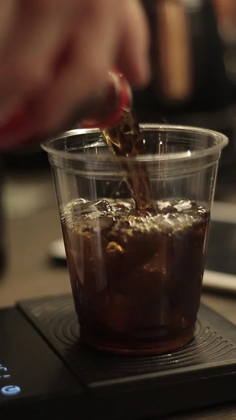 Coffe barista working to make a coffe. Hand drip coffeeTourists with drip coffee Stock Footage 161617522