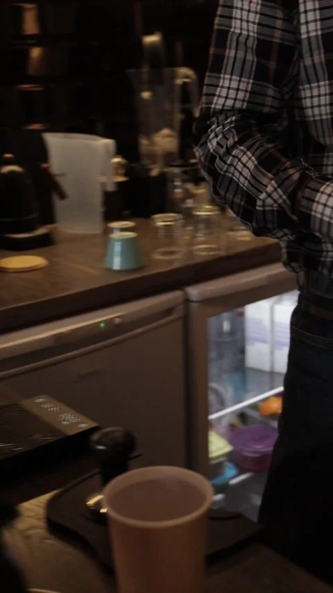 Coffe barista working to make a coffe. Hand drip coffeeTourists with drip coffee Stock Footage 161617561