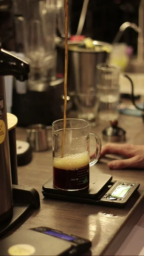 Coffe barista working to make a coffe. Hand drip coffeeTourists with drip coffee Stock Footage 161617584