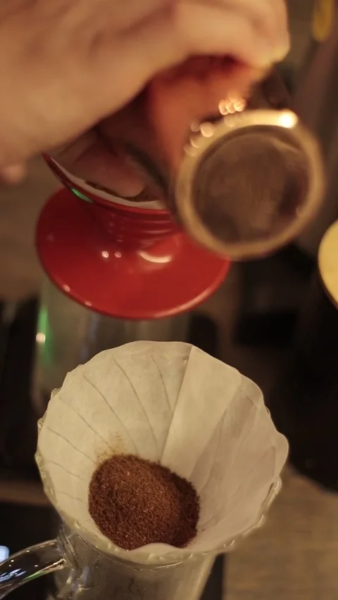 Coffe barista working to make a coffe. Hand drip coffeeTourists with drip coffee Stock Footage 161617728