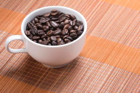 Coffe bean in cup Stock Photos