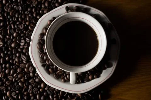 Coffe beans and cup. Stock Photos