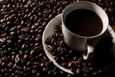 Coffe beans and cup. Stock Photos