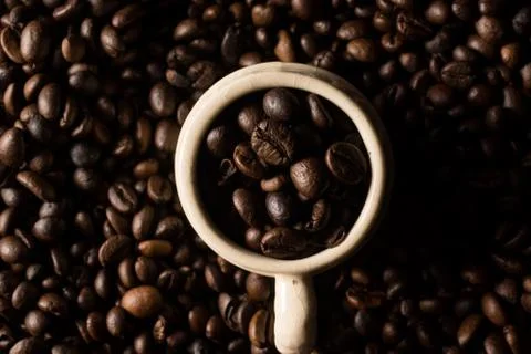 Coffe beans and cup. Stock Photos