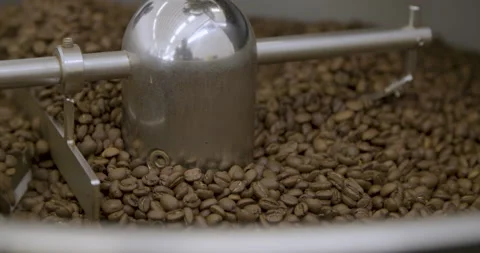 Coffe beans being roasted by machine Stock Footage 152447531
