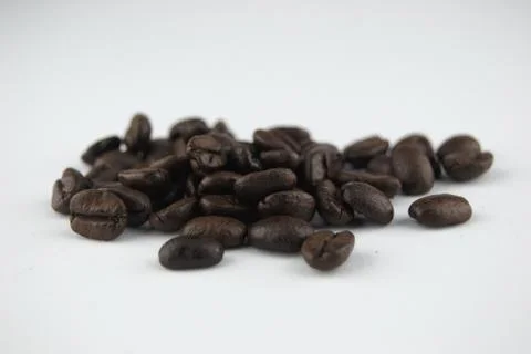 COFFE BEANS IN WHITE BACKGROUND Stock Photos
