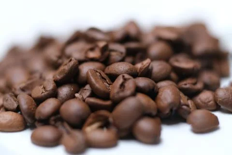 Coffe beans white background, shallow depth of field Stock Photos