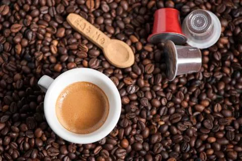 Coffe cup and pods Stock Photos