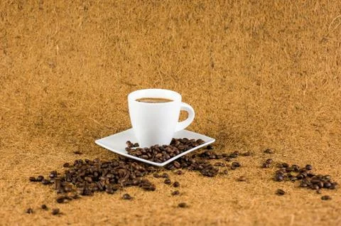 Coffe cup on brown background texture Stock Photos